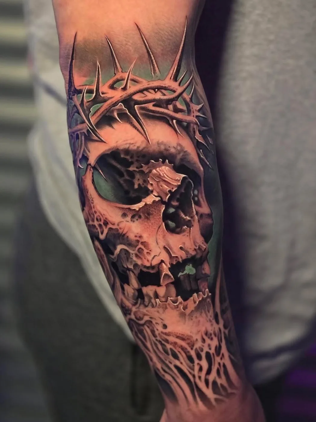 Skull and crown of thorns, color realism by Gage Cheesman, Alliance Tattoo Eugene Oregon