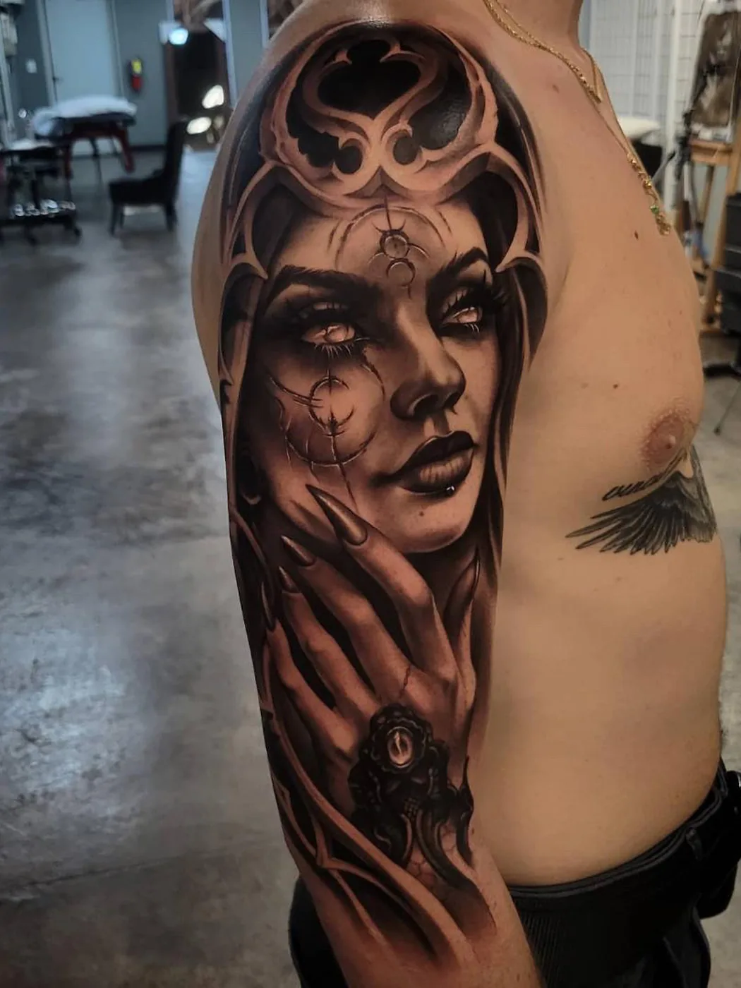 Dark woman portrait rib piece by Gage Cheesman, Alliance Tattoo Eugene Oregon