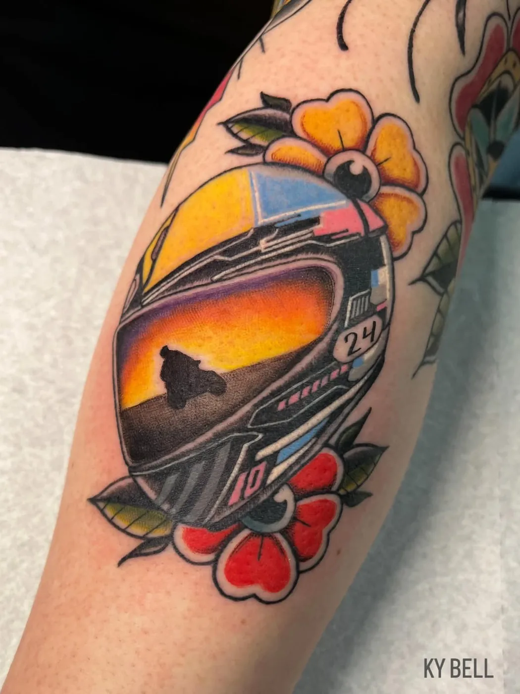 Traditional race helmet with sunset visor and flowers by Ky Bell, Alliance Tattoo Eugene Oregon